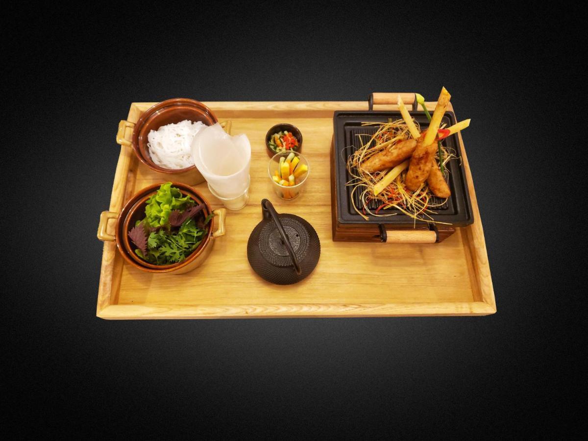 Peridot Grand Luxury Boutique Hotel Ханой Экстерьер фото A bamboo serving tray